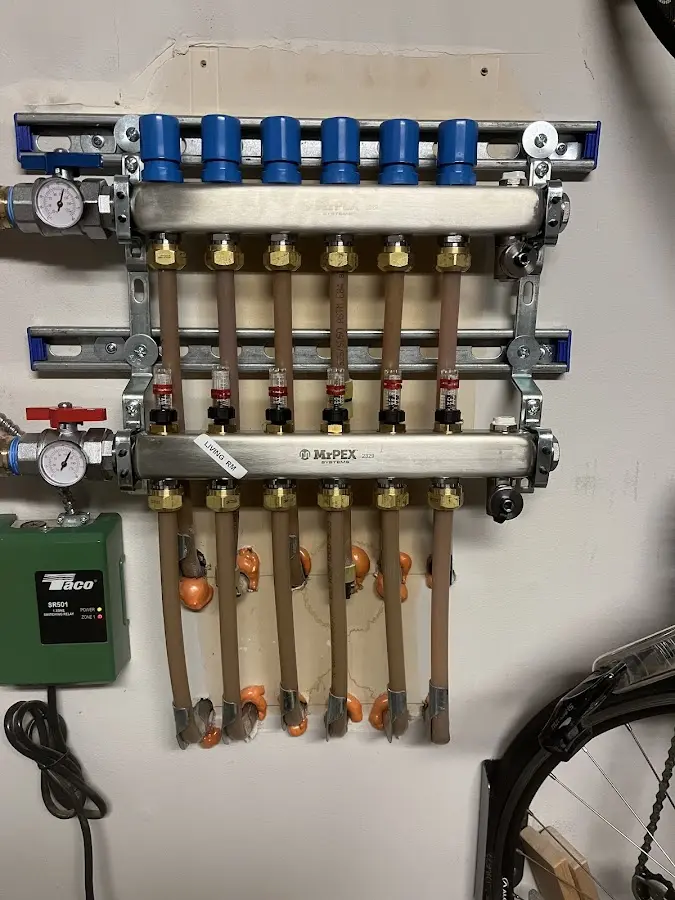 Plumber performing Water Heater Repair at a residential property in Prosser